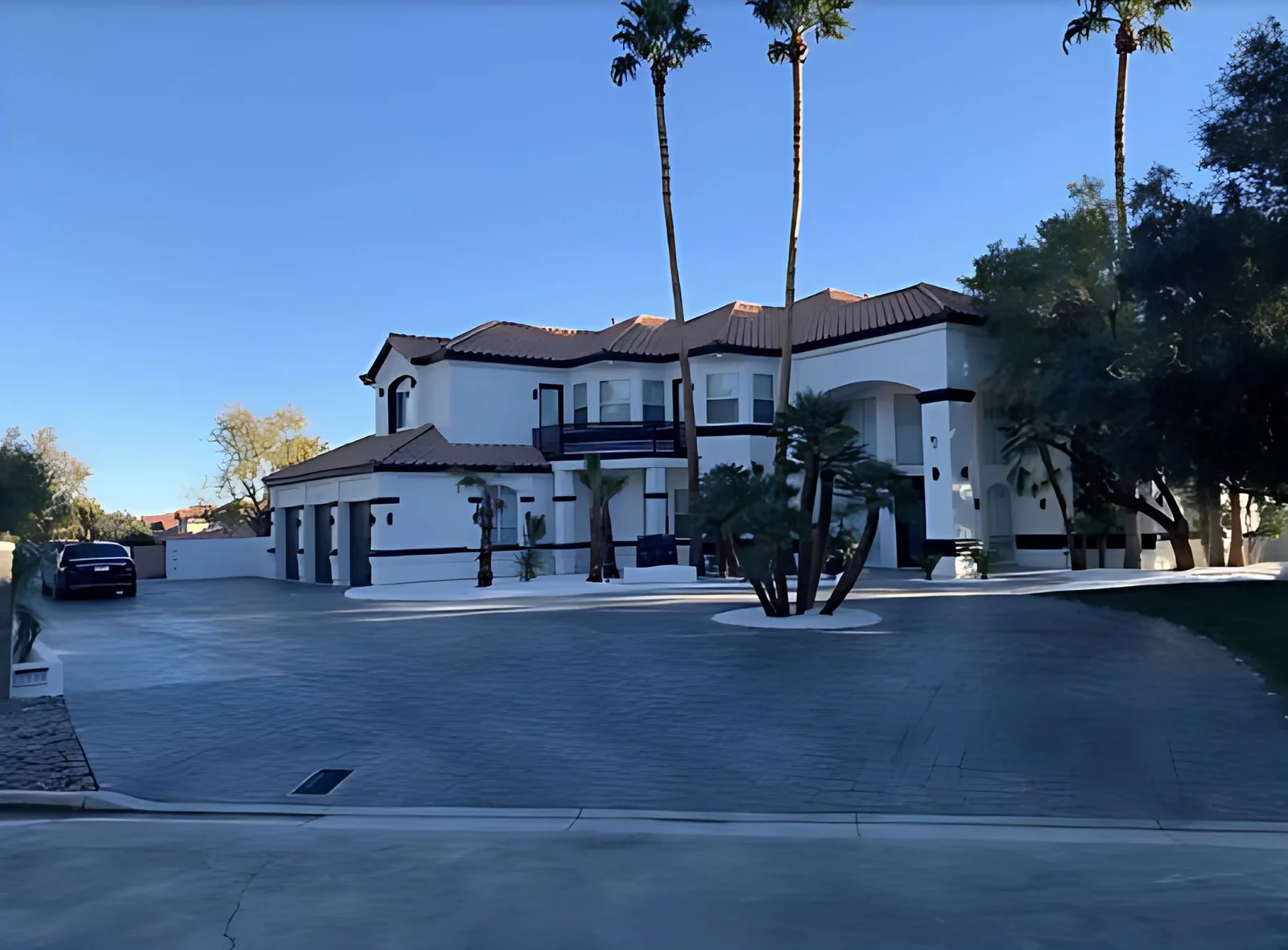 Circle driveway in front of a two story home