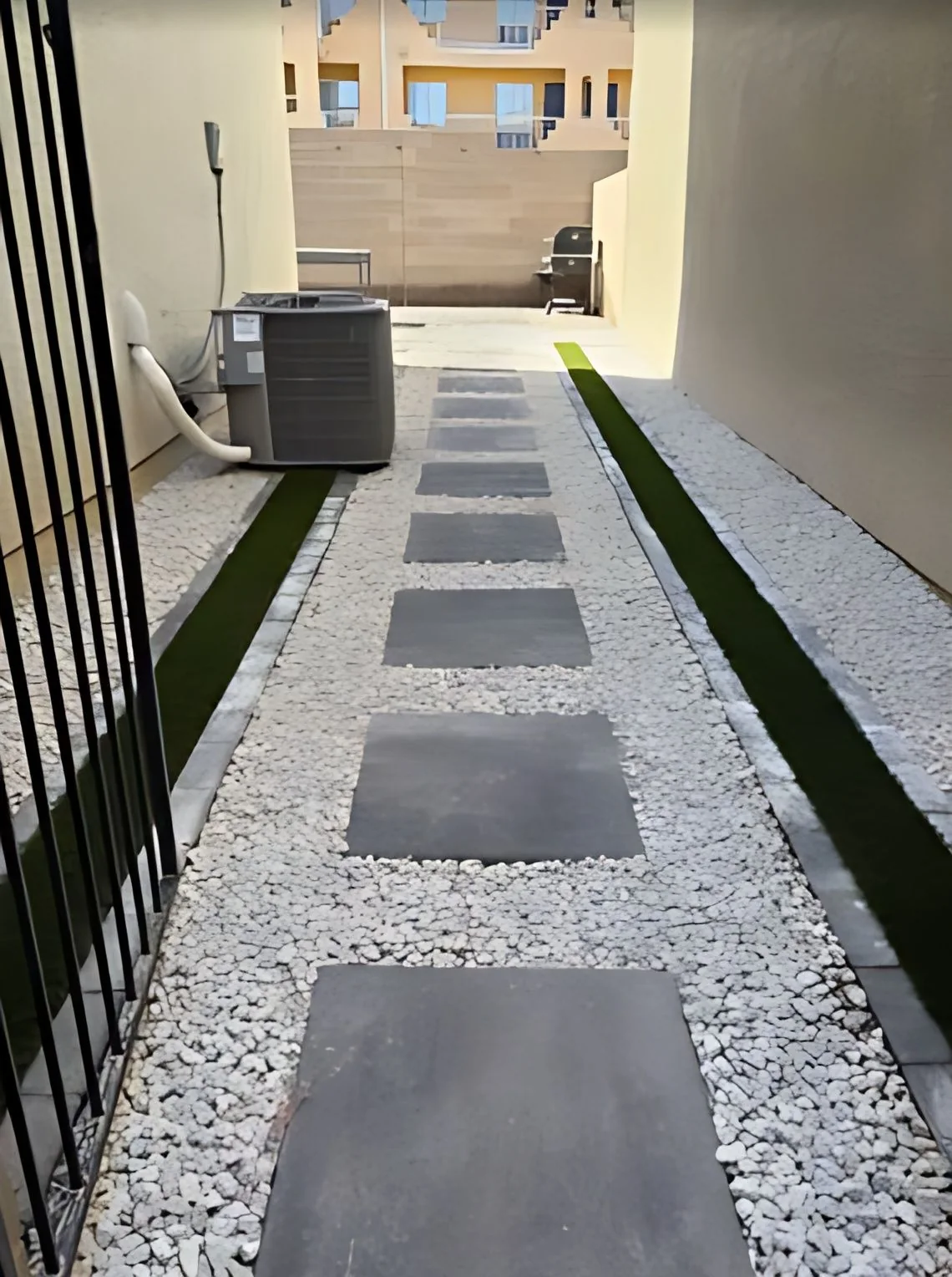 Side yard path of stepping pads in white rock